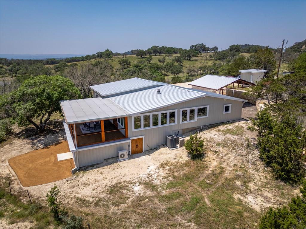 a aerial view of a house with a yard