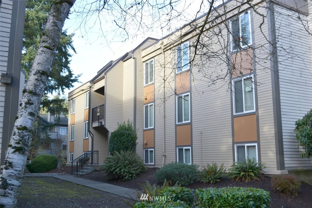 a view of a building with a yard