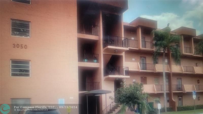 a view of building with balcony