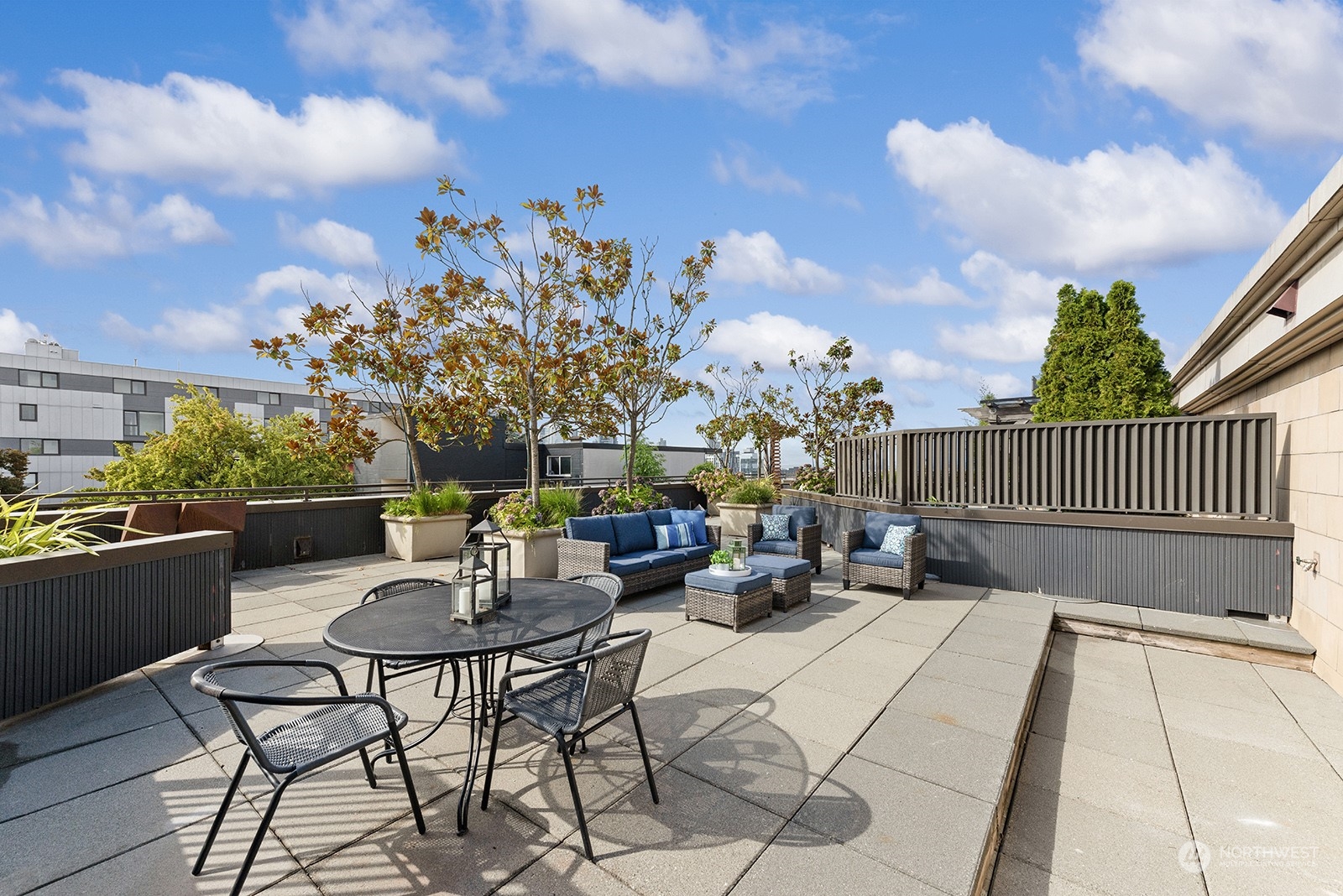 a view of a chairs and tables in the back yard of the house