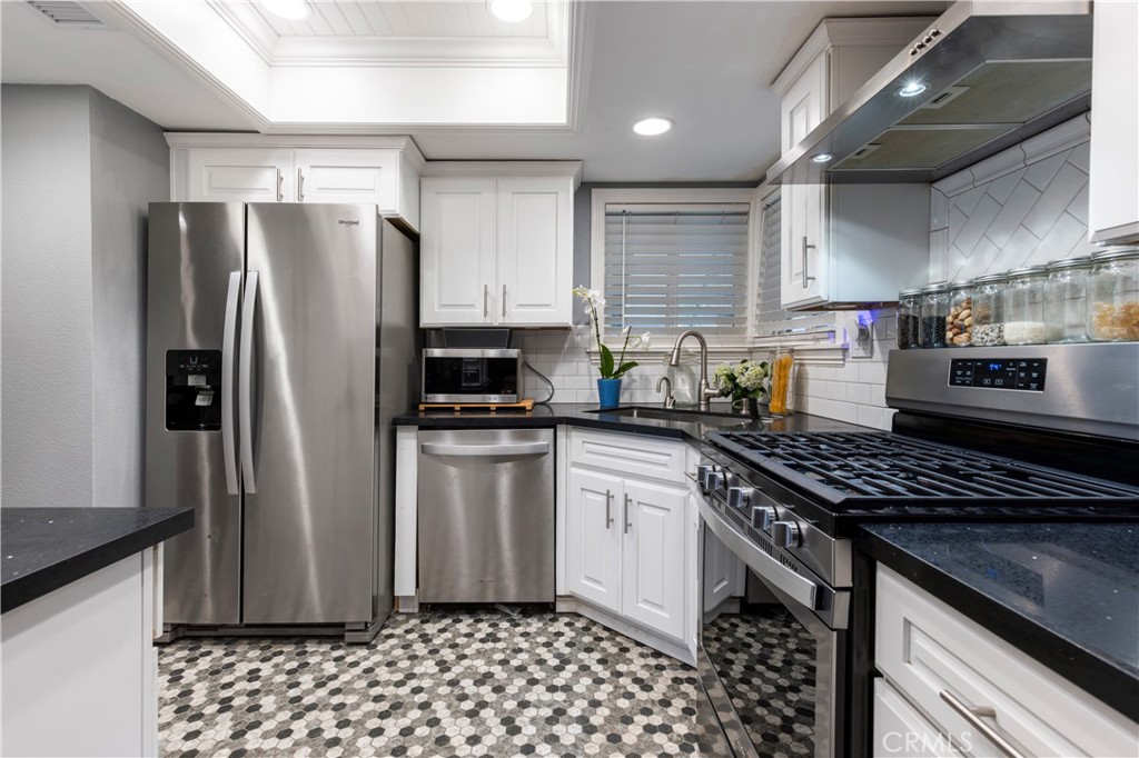 SMART stainless appliances, new cabinets and countertops, new backsplash, new flooring and ceiling lighting