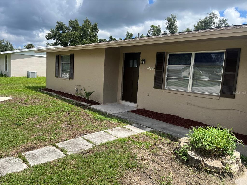 front view of a house with a yard