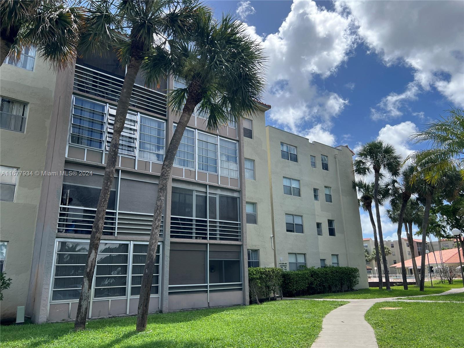 a view of building with yard