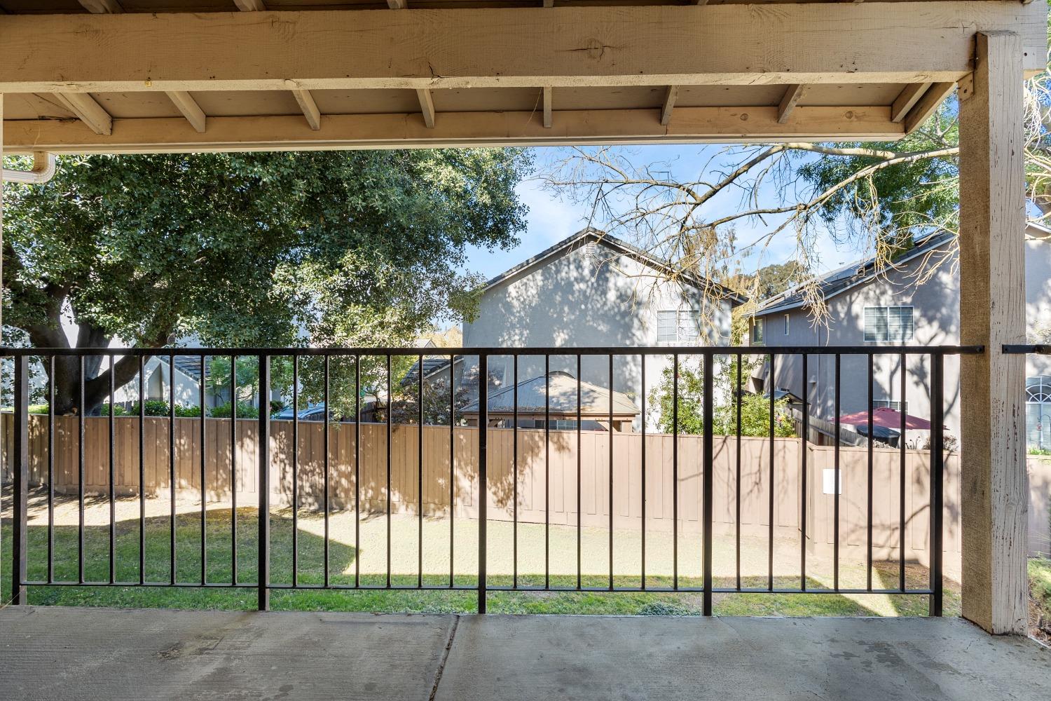 a view of a wrought iron fences in front of house