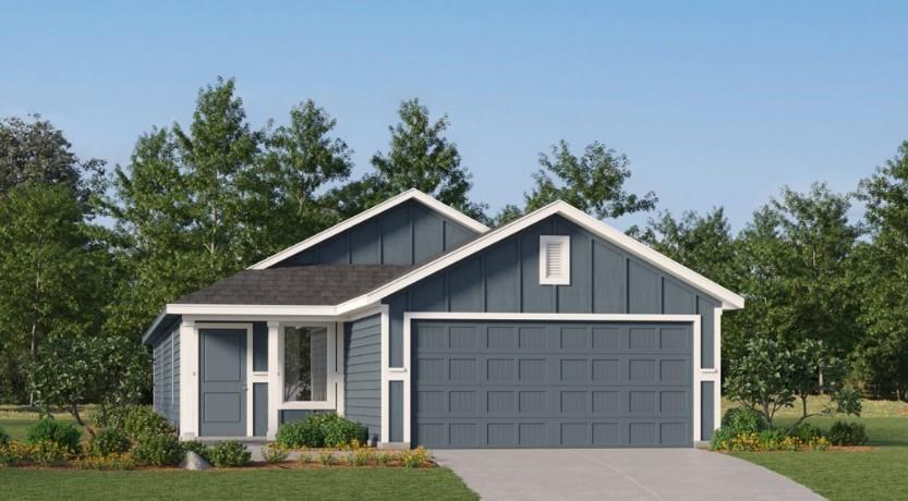 a front view of a house with a yard and trees