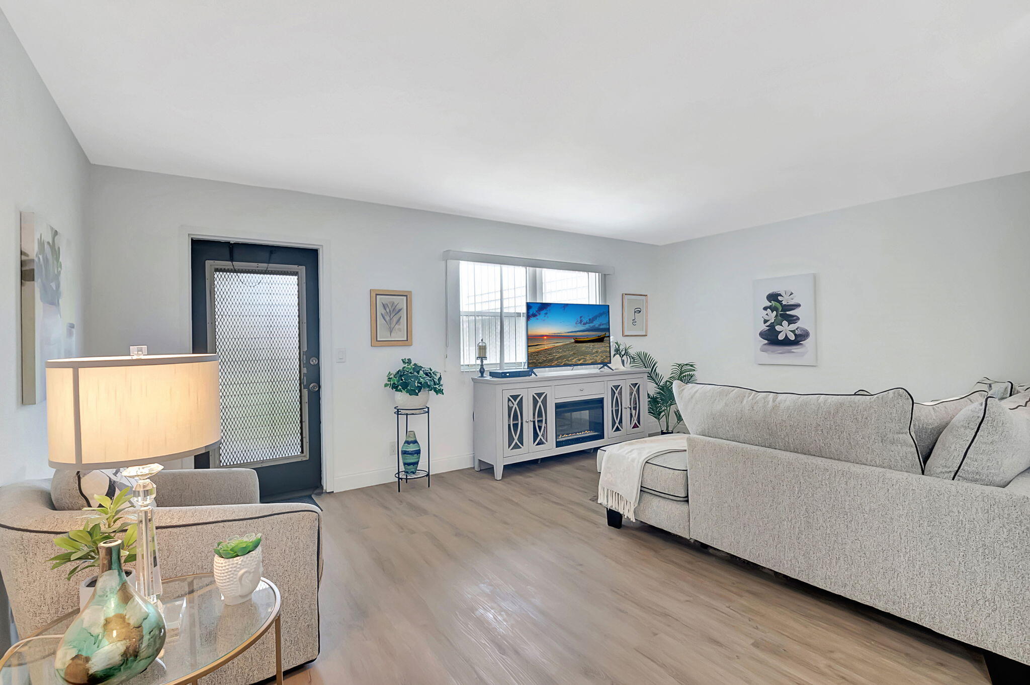 a living room with furniture and a flat screen tv