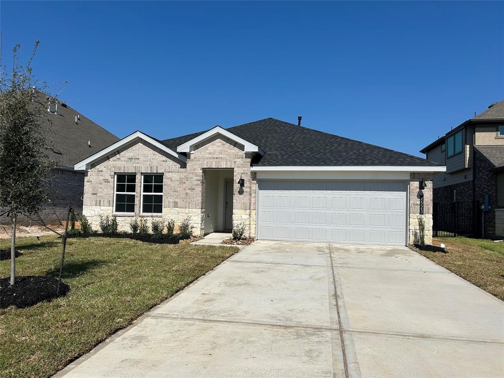 a view of house with outdoor space and parking