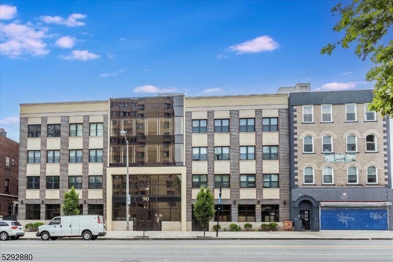 a front view of a building with street view