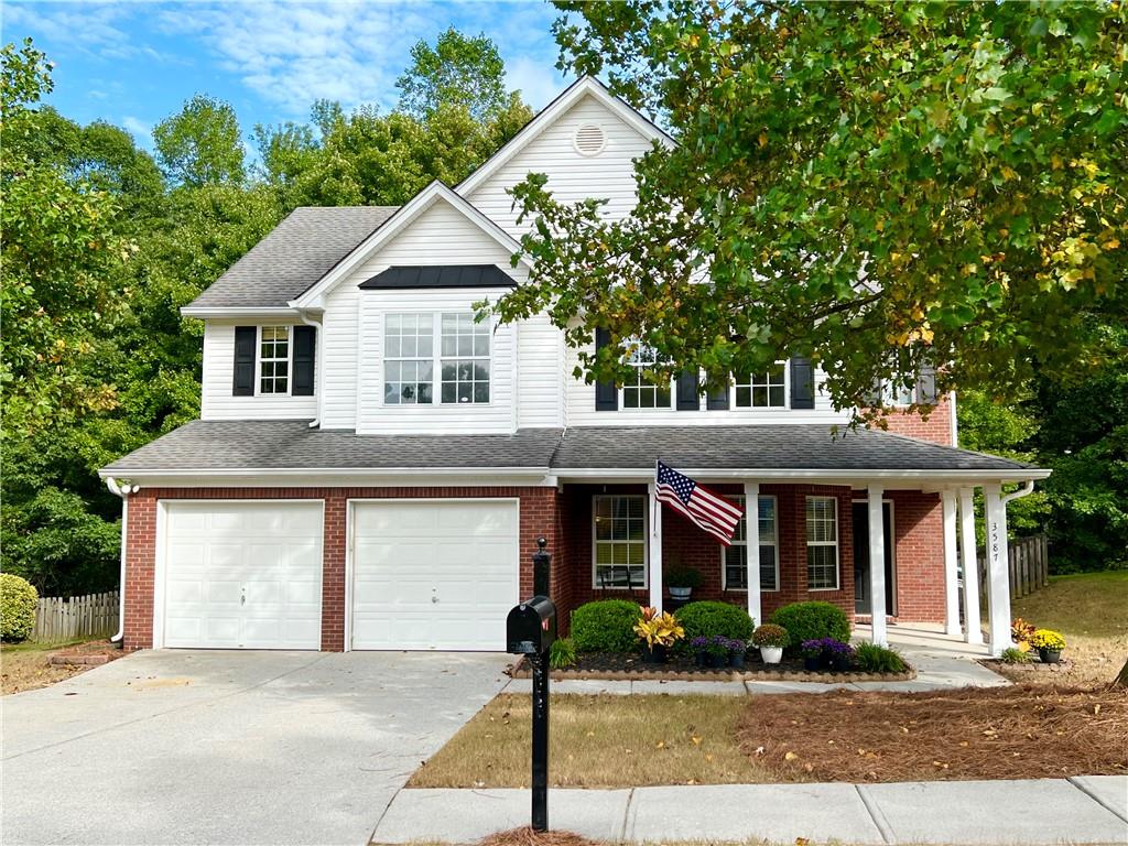 front view of a house with a yard