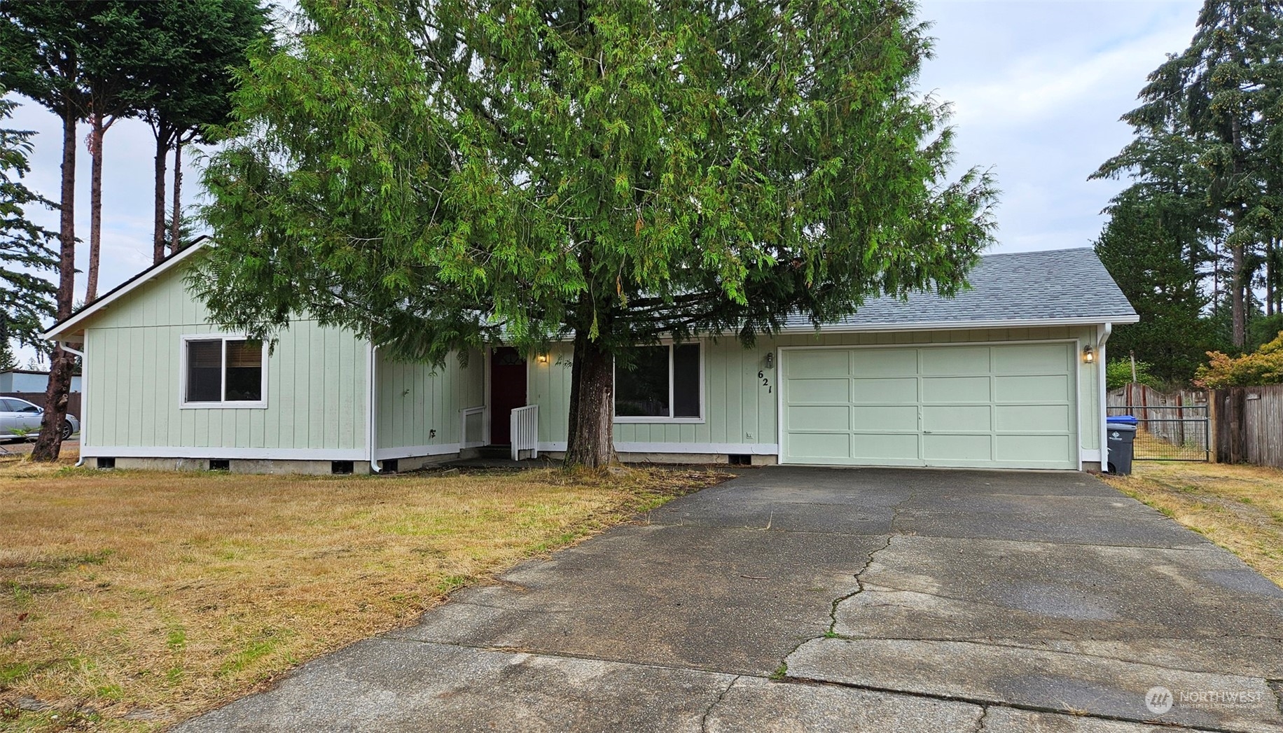 a view of a house with a yard and garage