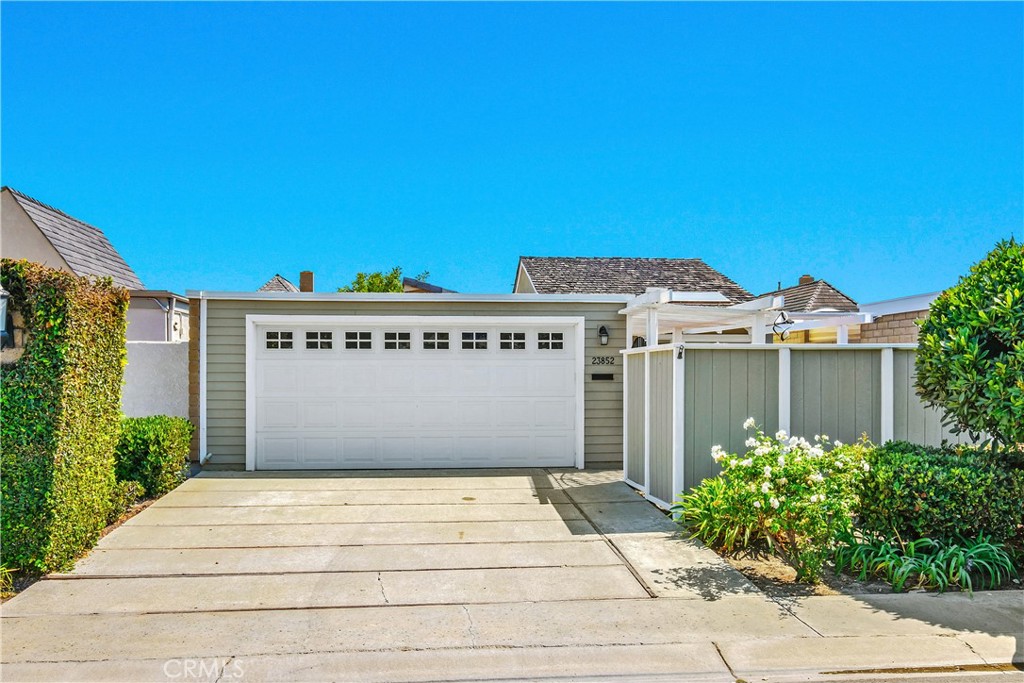 a view of a parking space with a small yard