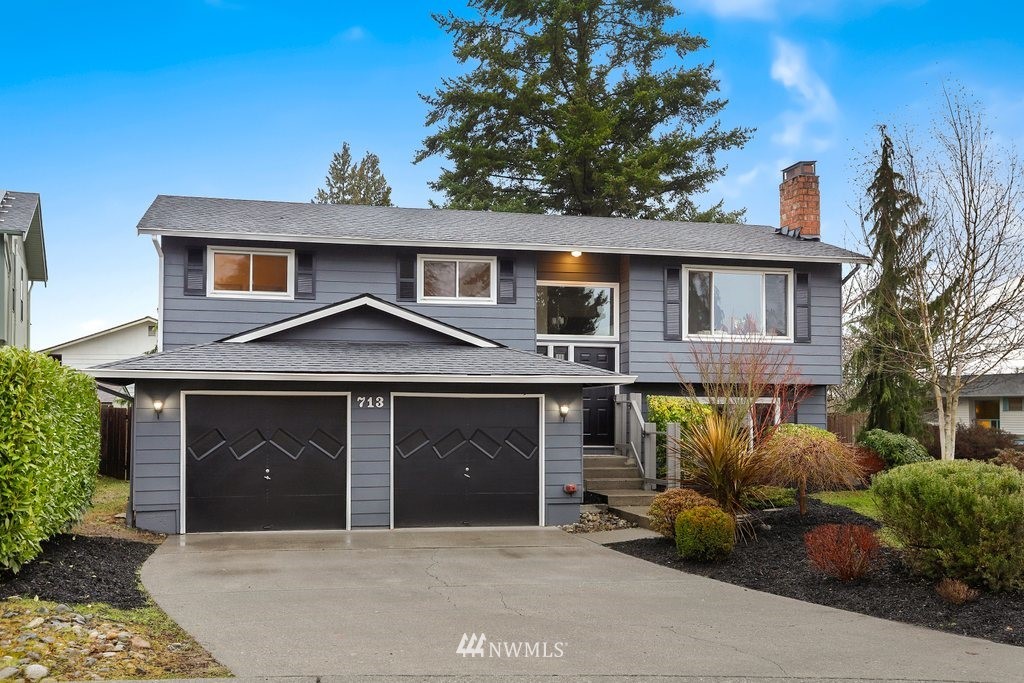 a front view of a house with garage