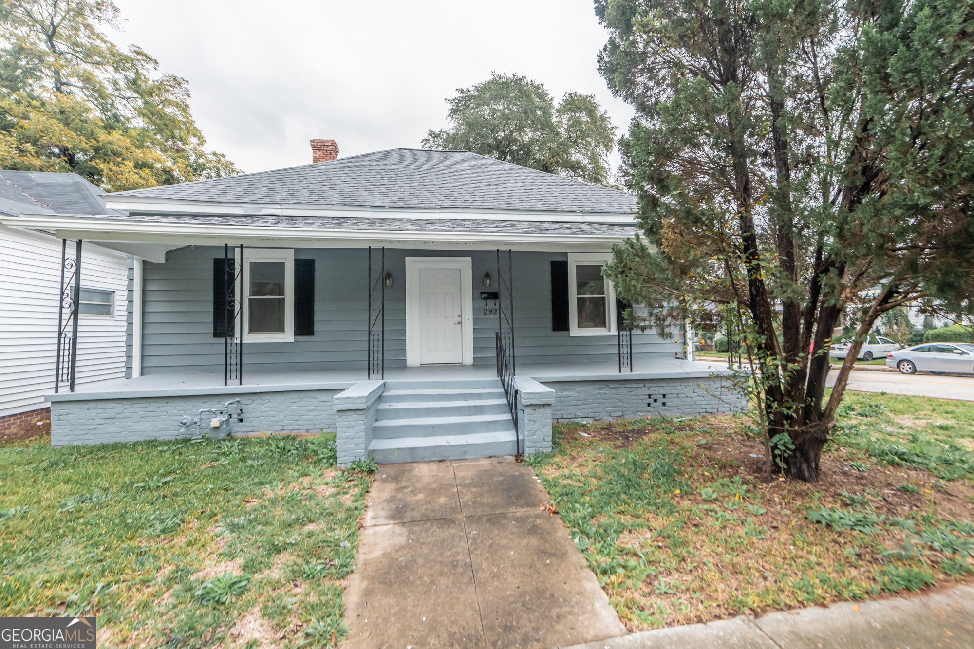 a front view of a house with garden