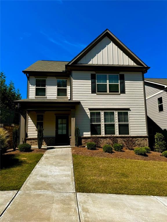 a front view of a house with garage