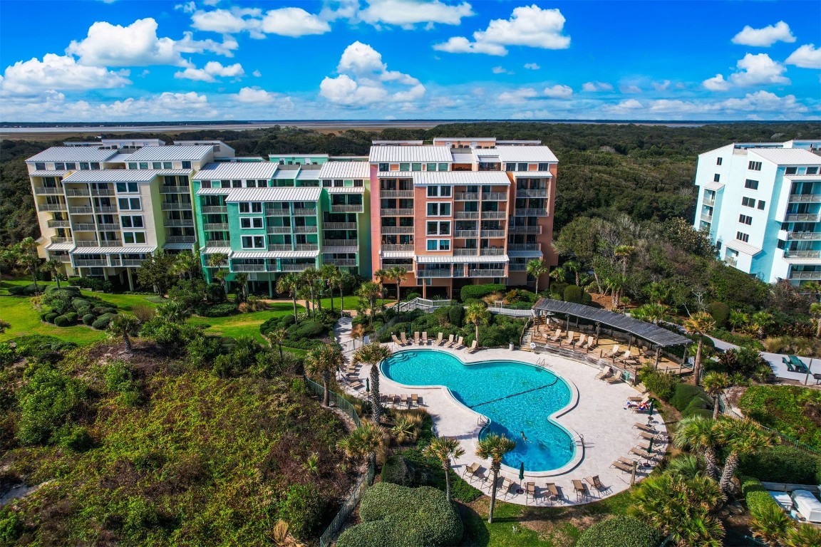 a view of a swimming pool with outdoor seating