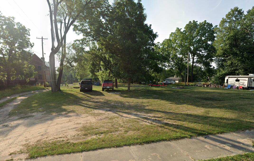 a view of a park with large trees