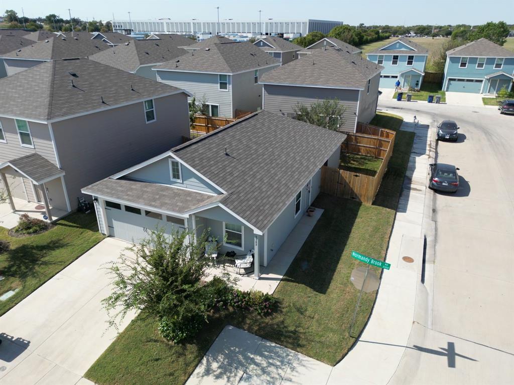 a aerial view of a house with a yard