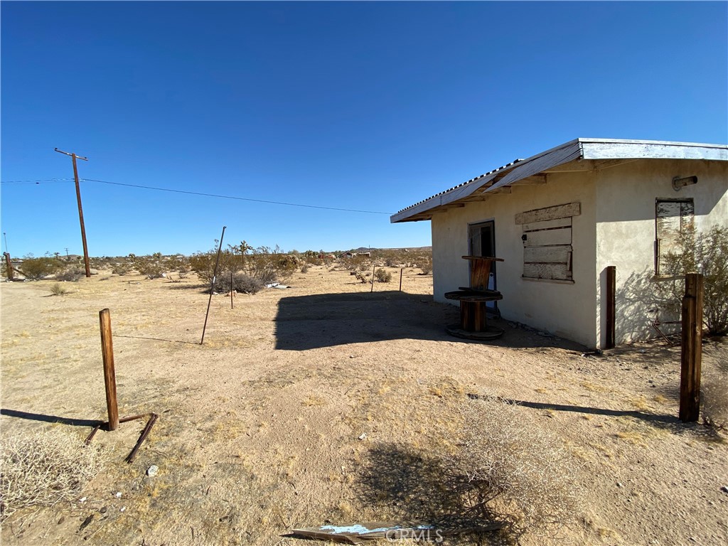 a view of a backyard of the house