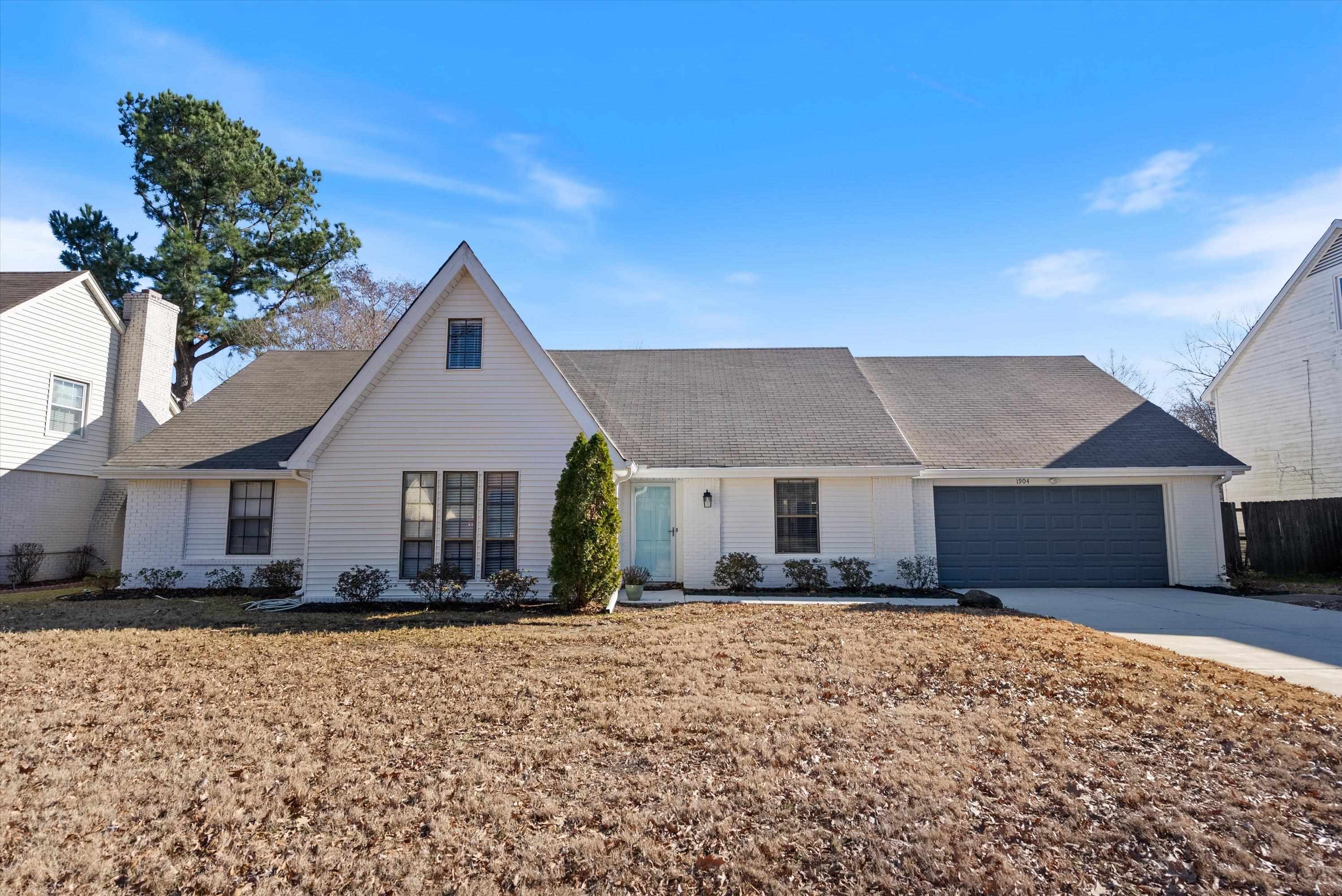 View of front of property featuring a garage