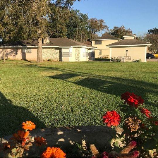 a view of a house with a big yard