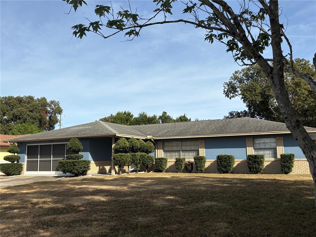 front view of a house with a garden