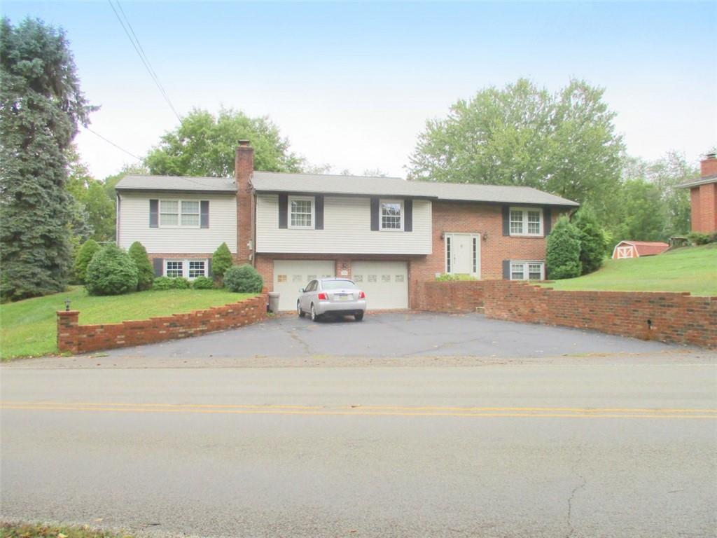 a view of a house with a outdoor space and a street