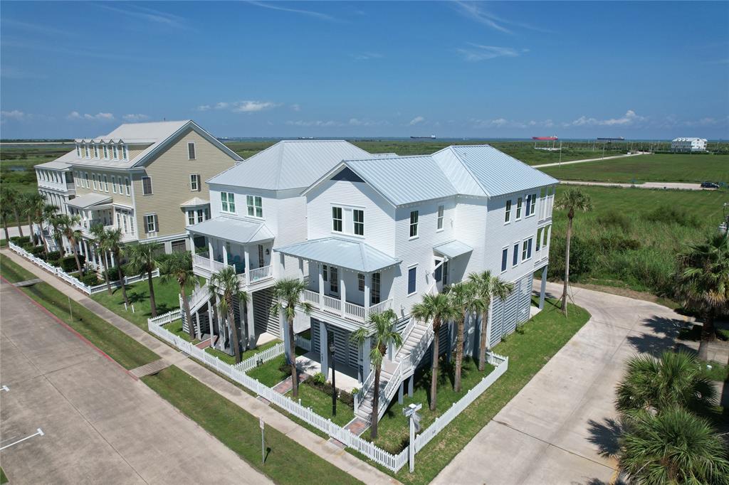 an aerial view of a house with a big yard