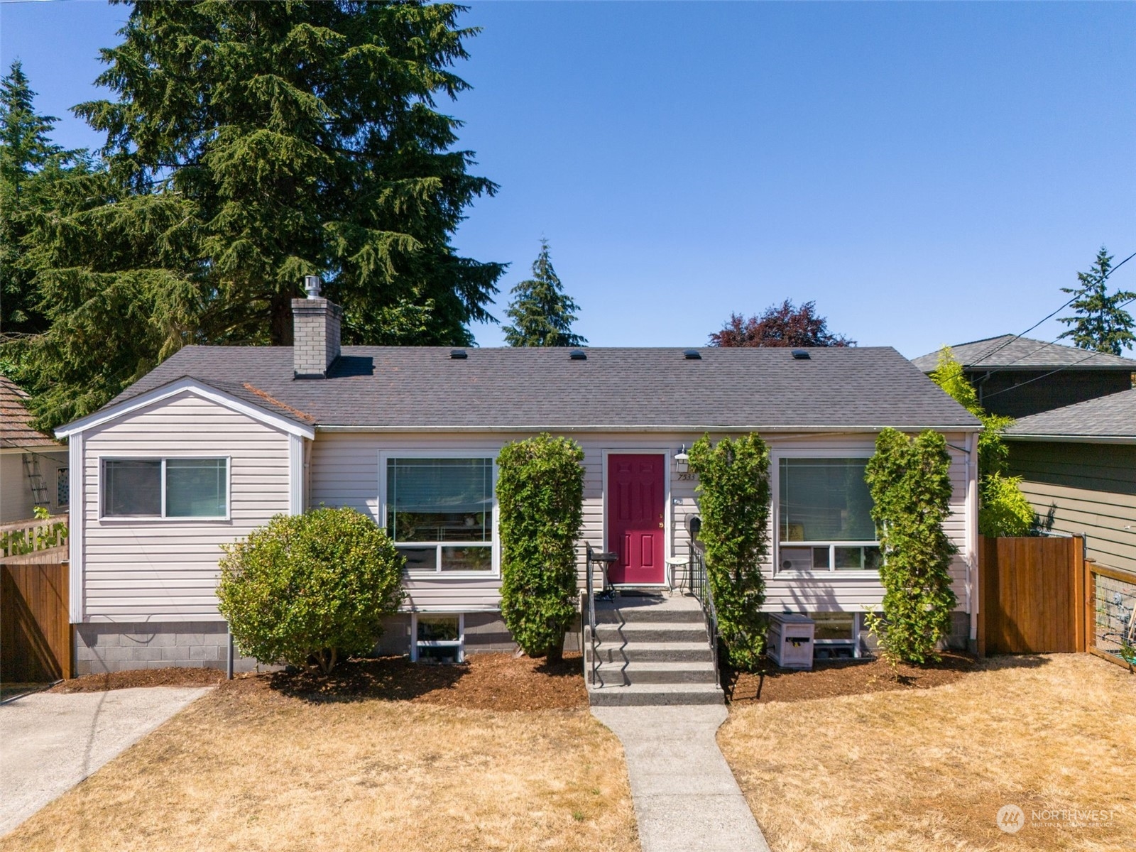 front view of a house with a yard