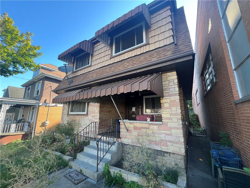 a front view of a house with garage