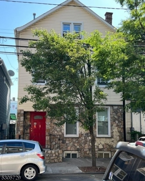 a car parked in front of a house