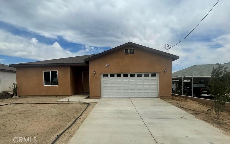 a front view of a house with a garage