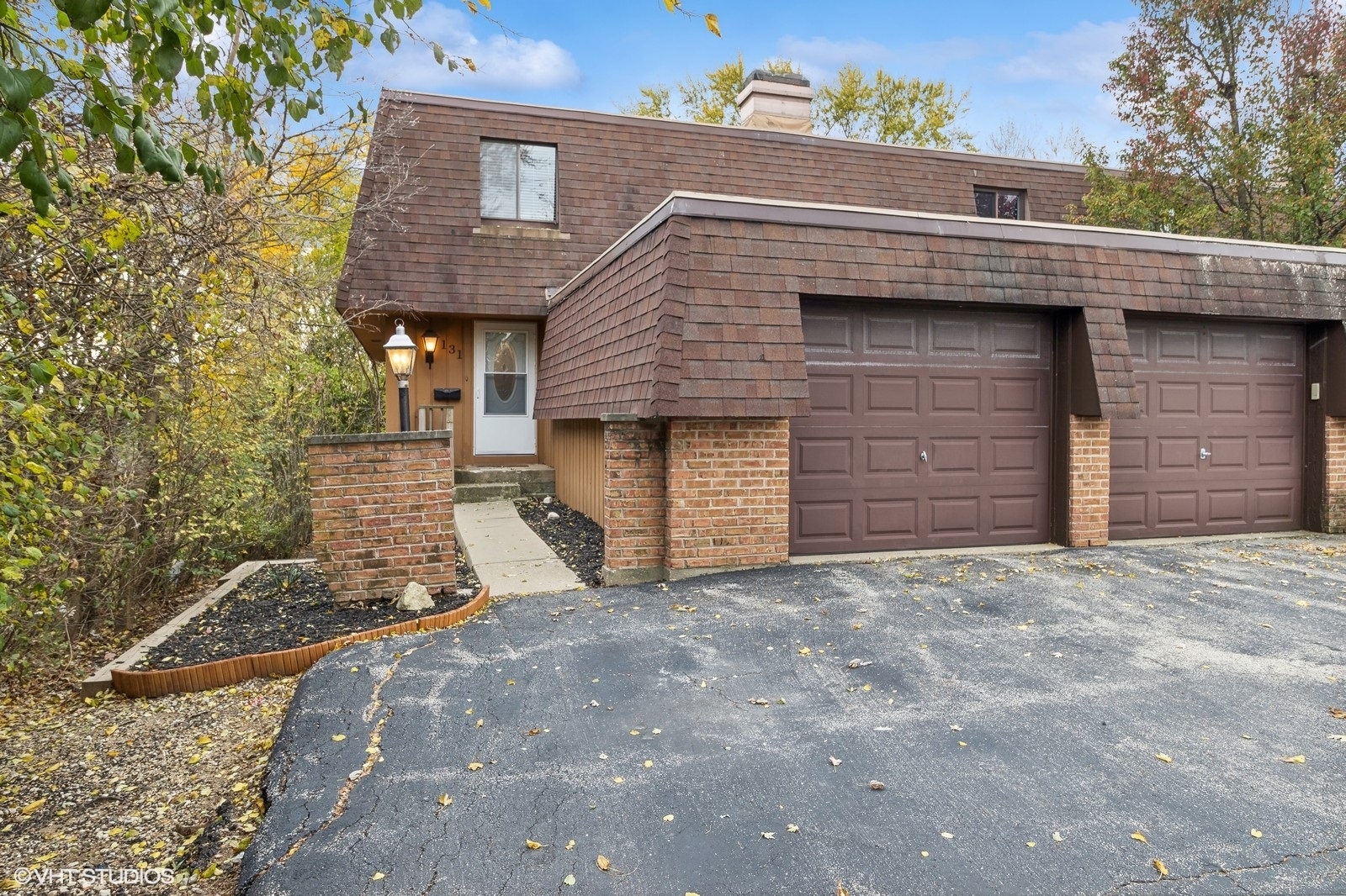 a front view of a house with garage