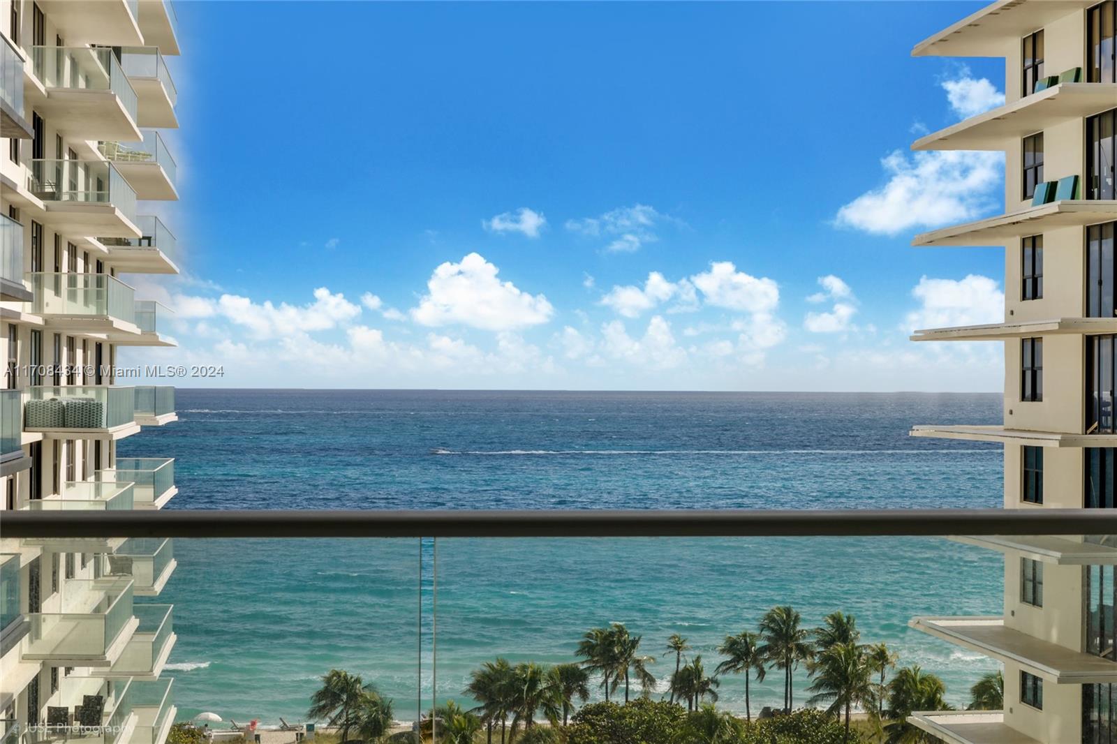 a view of a lake from a balcony