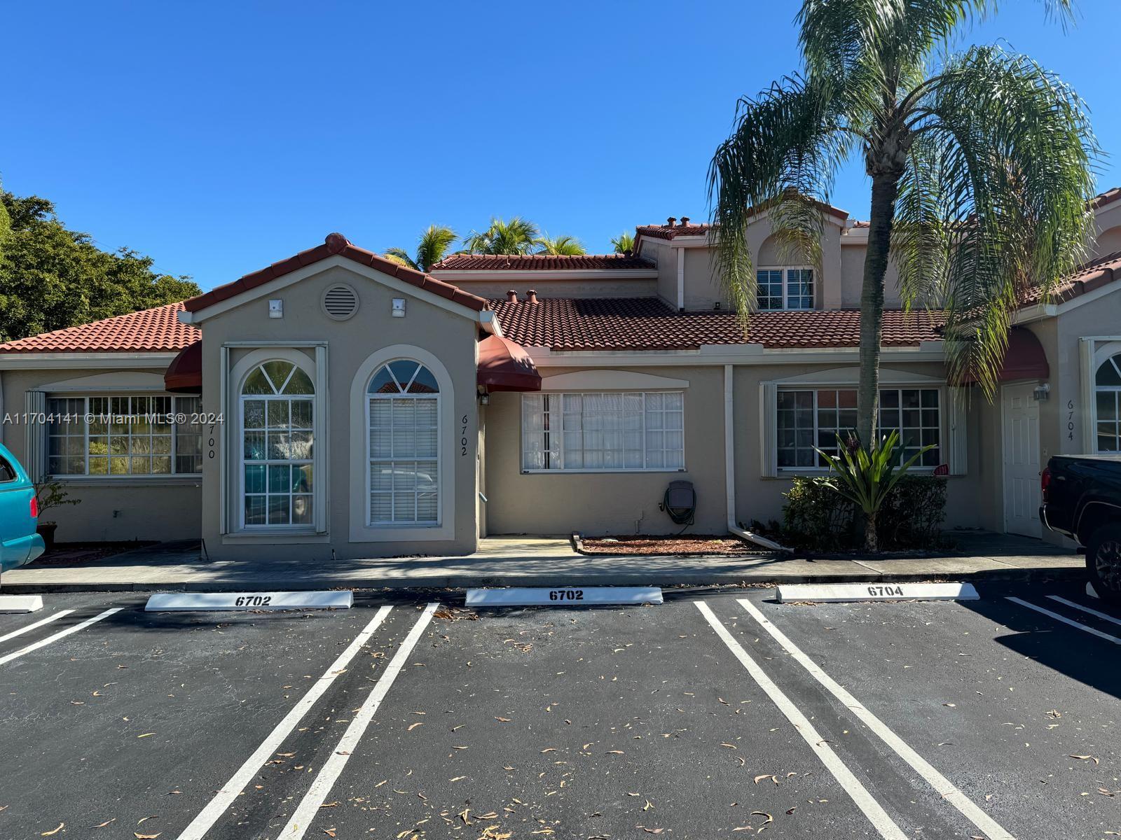 a front view of a house with yard