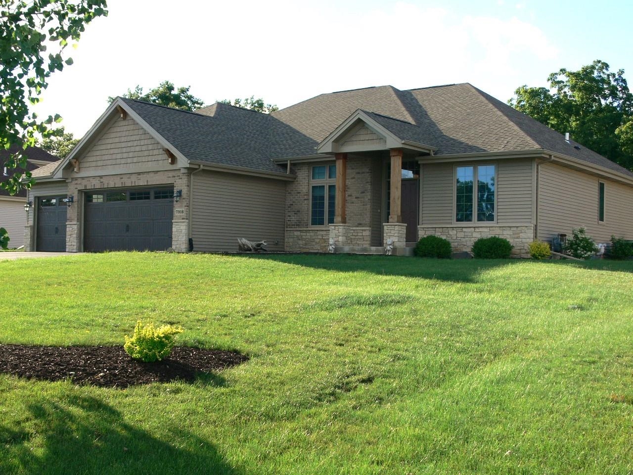 a view of a house with garden and yard