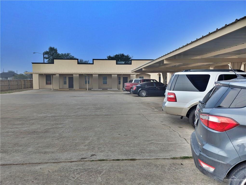 View of front of property with a carport