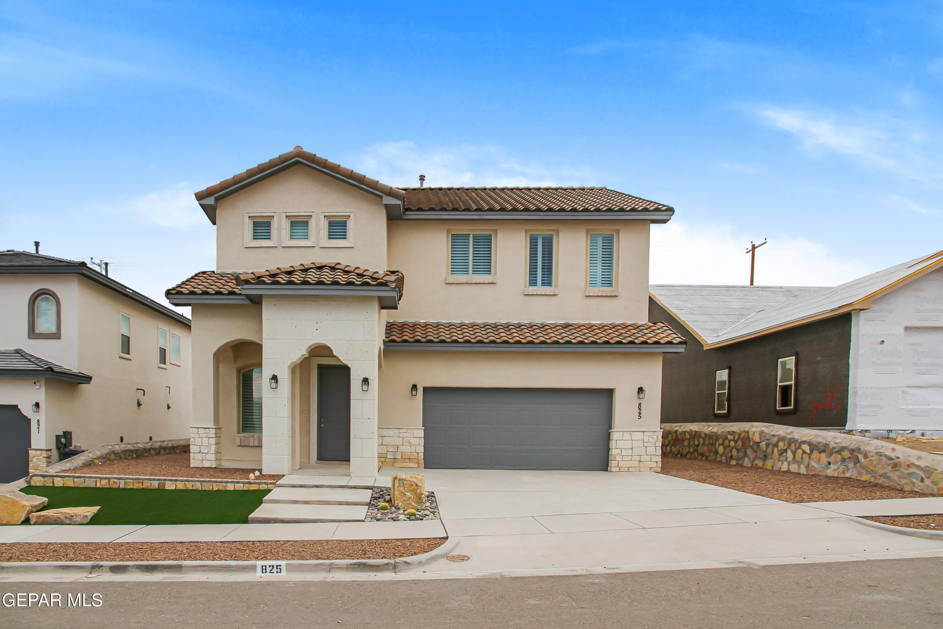 a front view of a house with yard