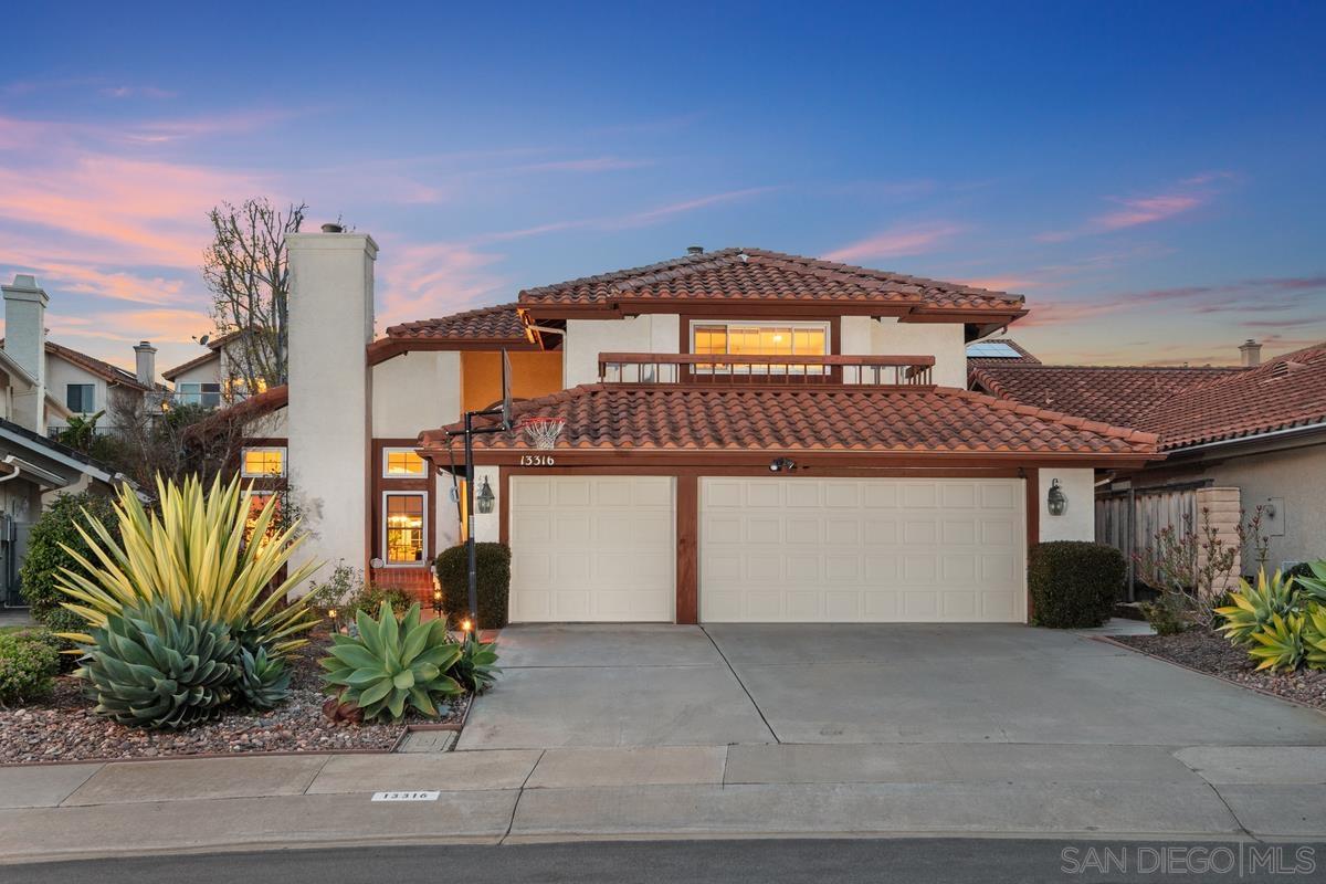 a front view of a house with a garage