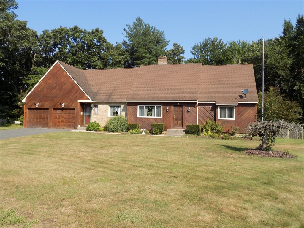 a aerial view of a house with swimming pool and garden