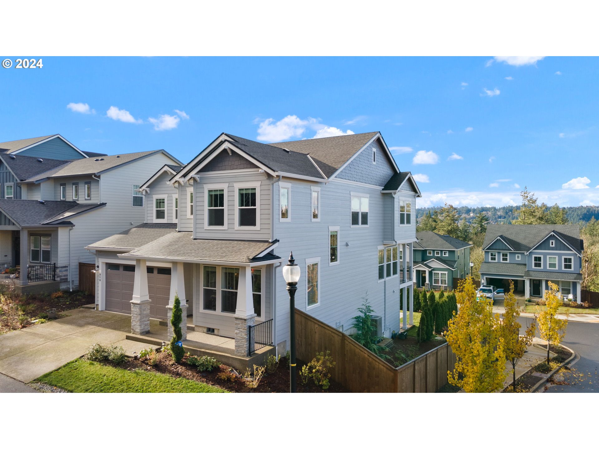 a aerial view of a house with a yard