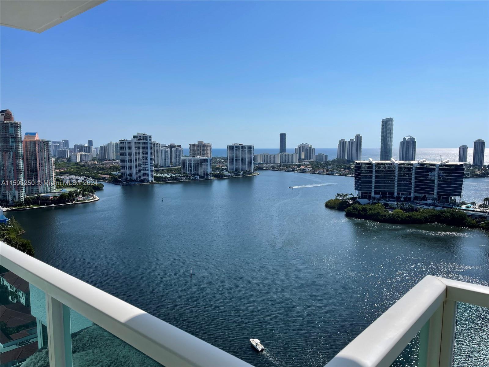 a view of a lake with tall buildings