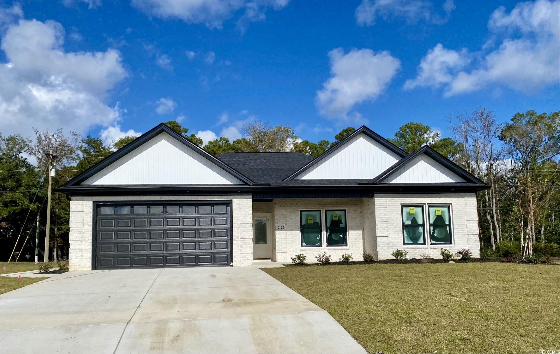 View of front of property with a front lawn and a