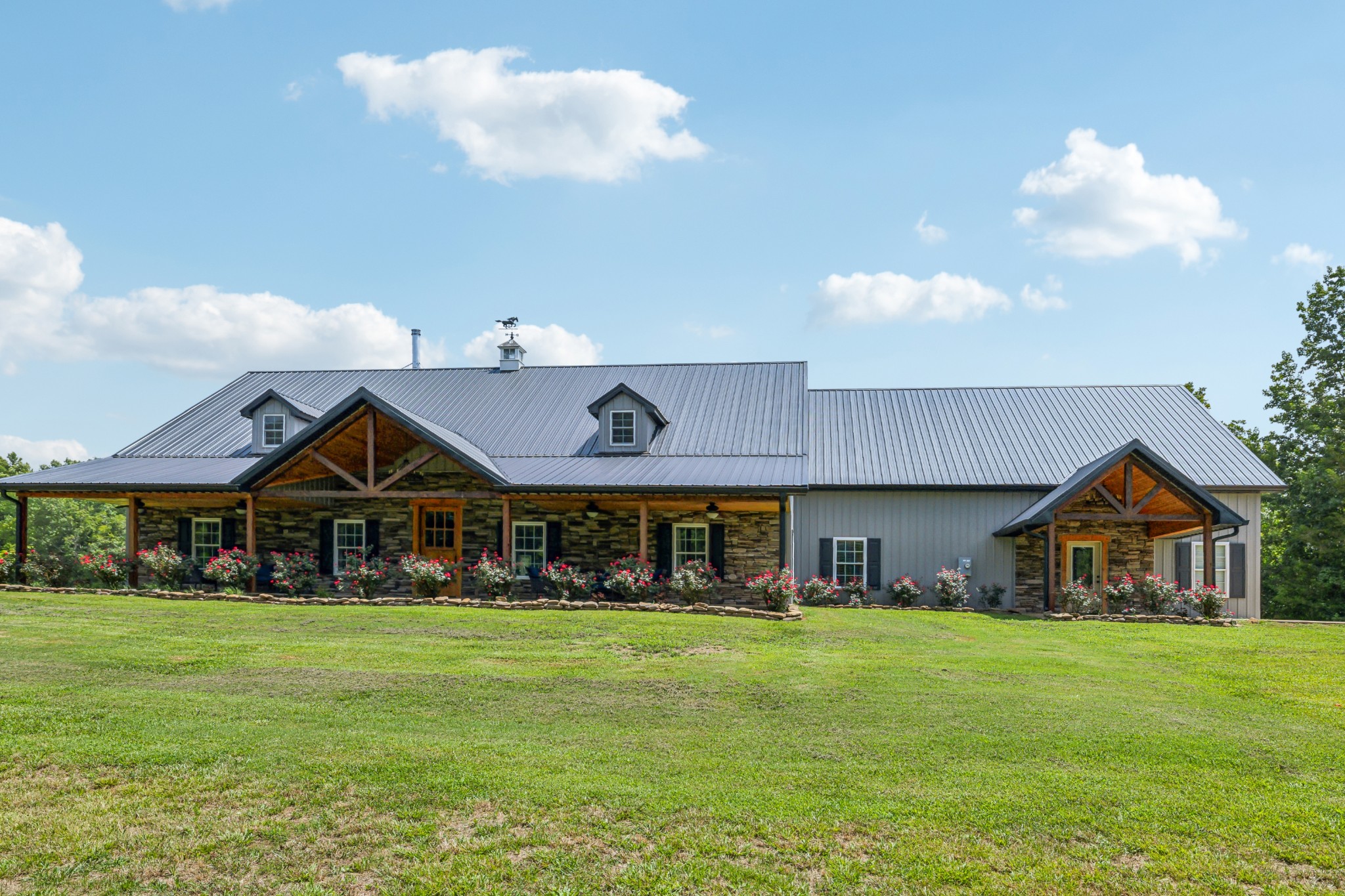 a front view of a house with garden