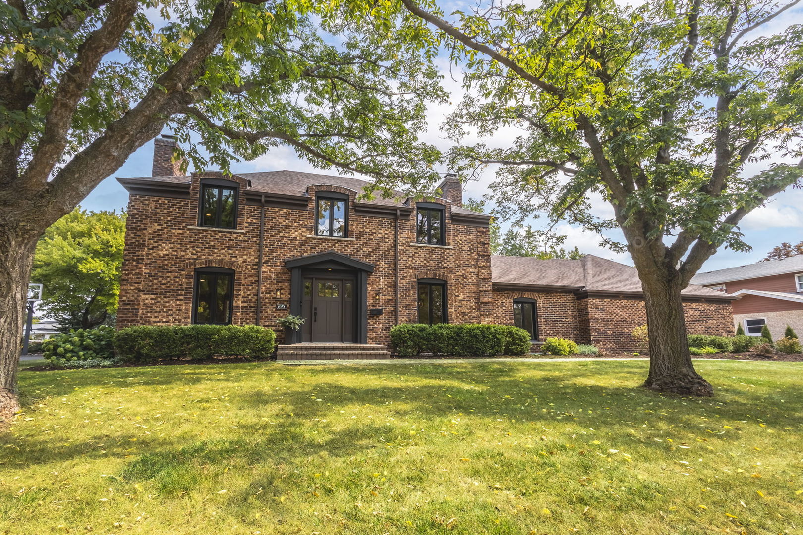 a front view of a house with a yard