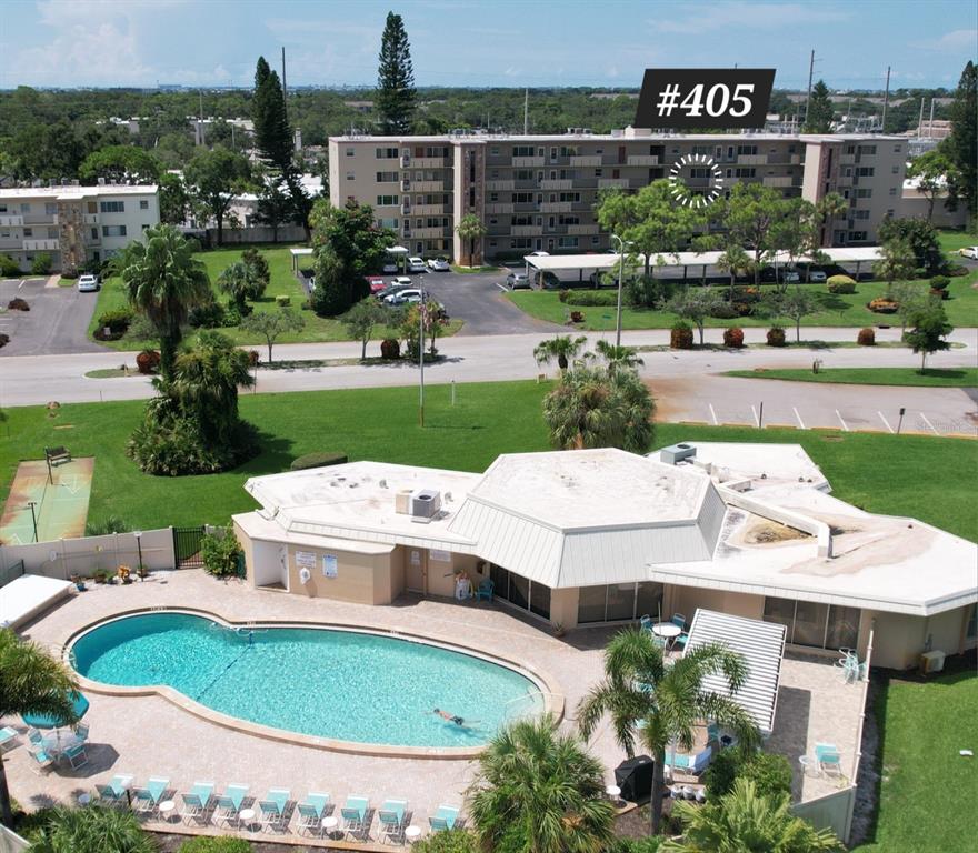 an aerial view of a house with yard swimming pool and outdoor seating