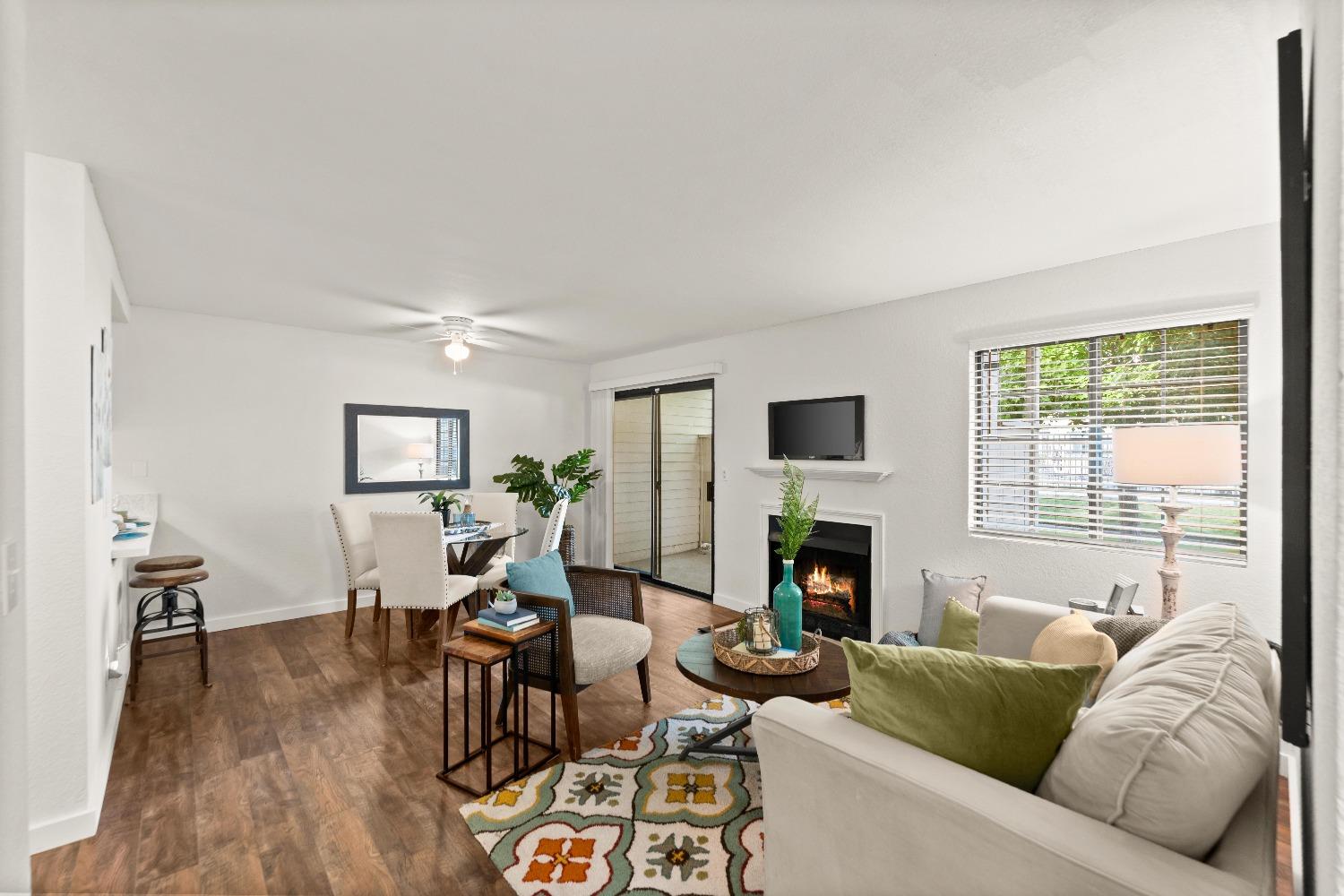 a living room with furniture fireplace and a flat screen tv