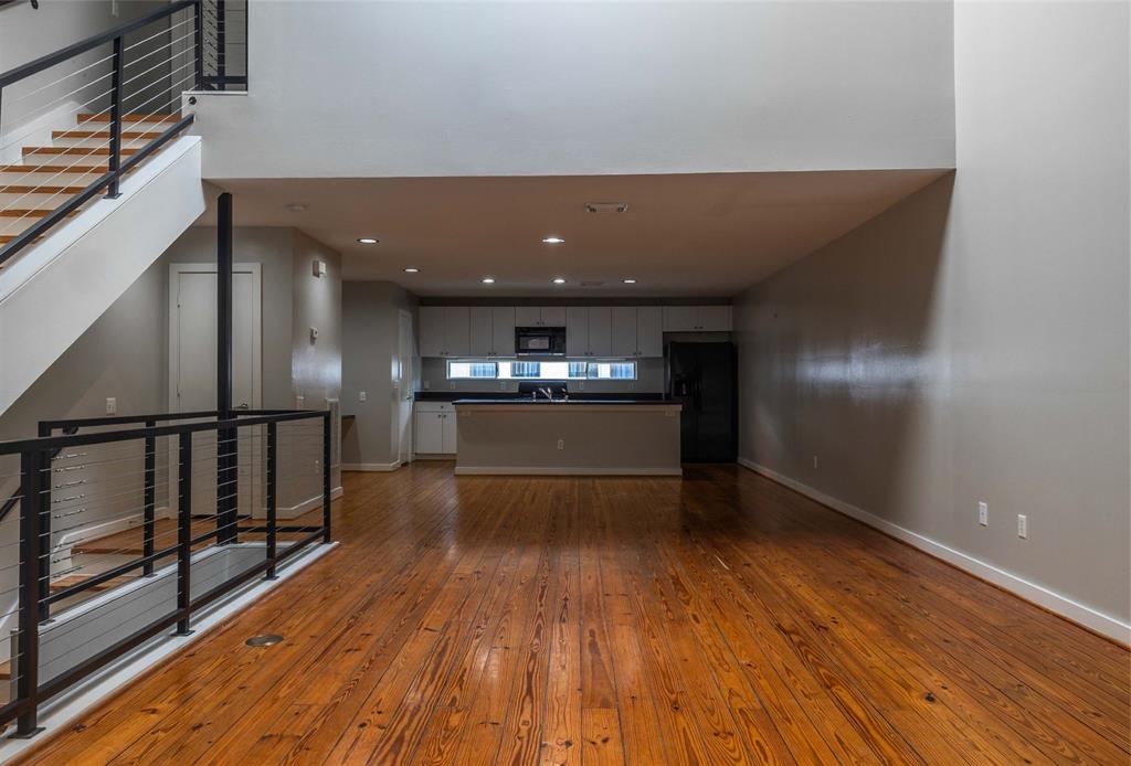 a view of gallery with wooden floor