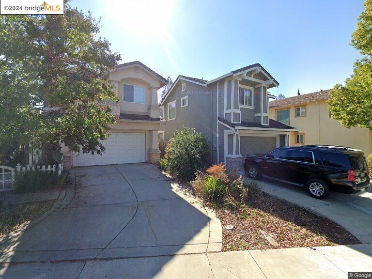 a car parked in front of a house