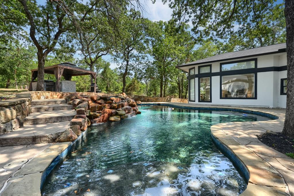 a view of a house with a yard from a patio