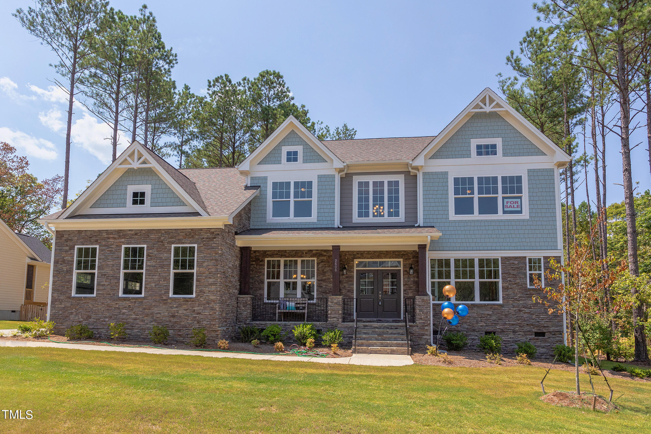 a front view of a house with swimming pool